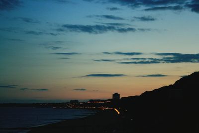 View of illuminated city at sunset