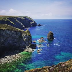 Scenic view of sea against blue sky