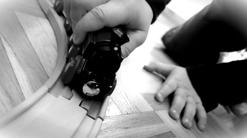 Close-up of young man holding camera