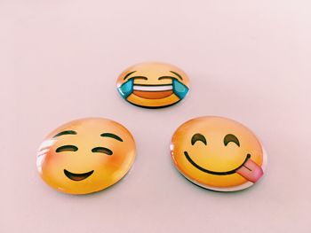 Close-up of smiley face against white background