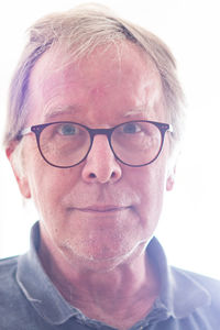 Close-up portrait of man wearing eyeglasses