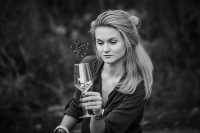 Portrait of young woman holding ice cream