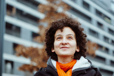 Portrait of smiling girl standing outdoors