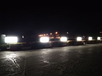 Illuminated street lights in city at night