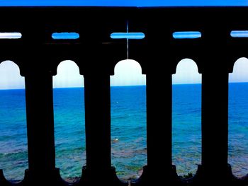 Scenic view of sea against blue sky