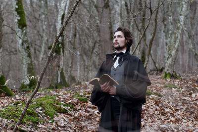 Portrait of man in period costume in forest