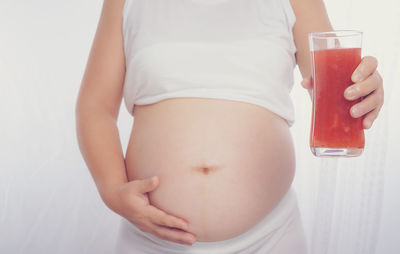 Midsection of woman with ice cream