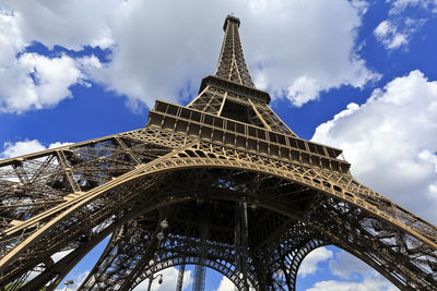 Low angle view of tower against cloudy sky