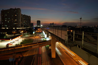 High angle view of light trails on city at night