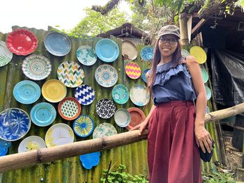 Rear view of woman standing by plants