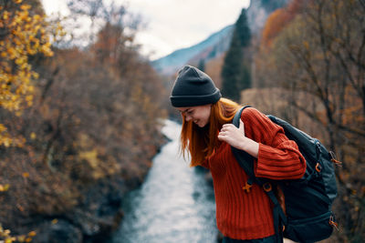 Young woman standing on road during winter