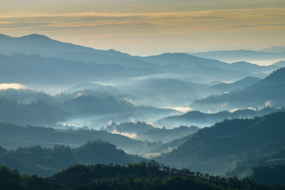 Scenic view of mountains against sky during sunset