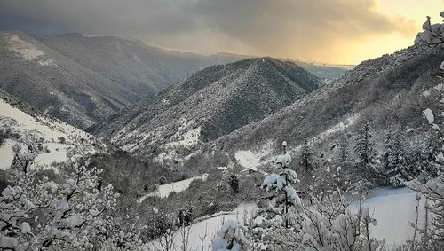 Scenic view of mountains against sky during winter