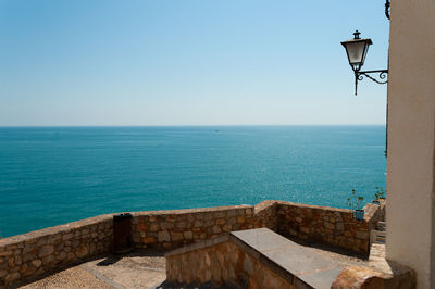 Scenic view of sea against clear blue sky