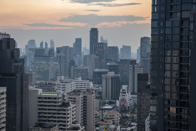 Cityscape against sky during sunset