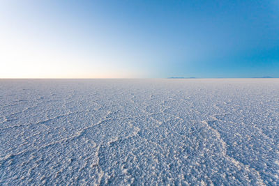 Scenic view of landscape against clear blue sky