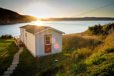 Scenic nova scotia - steps leading to a house near the water at sunset