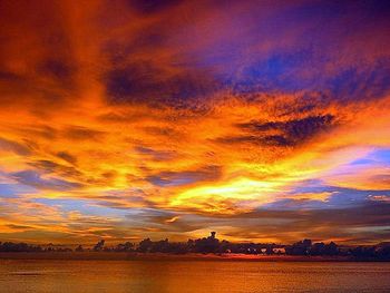 Scenic view of landscape against cloudy sky