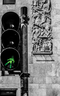 Low angle view of statue against building