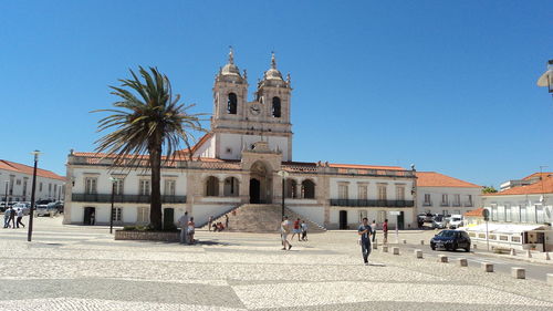 Low angle view of church against clear blue sky