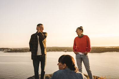 Friends relaxing at sea