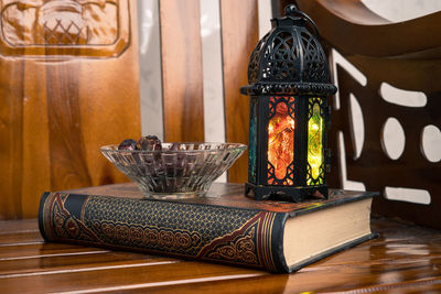 Close-up of illuminated candles on table at home