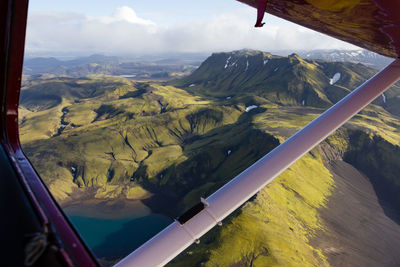 Scenic view of mountains seen through airplane window