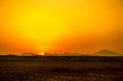 Scenic view of landscape against sky during sunset
