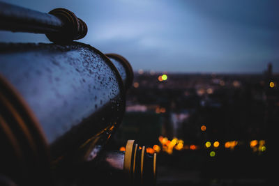 Close-up of illuminated cityscape against sky at night