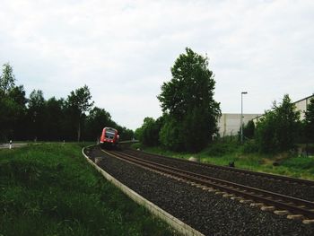 Train on railroad track against sky