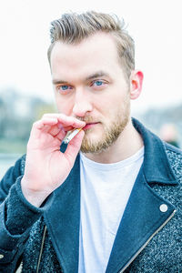 Portrait of man smoking