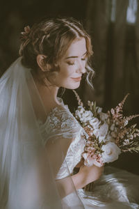 Portrait of bride holding bouquet