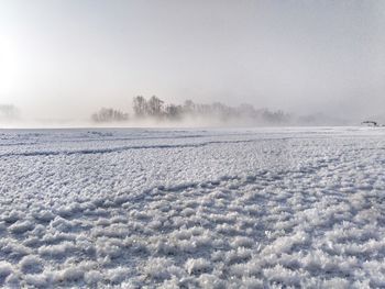 Scenic view of landscape against sky during winter