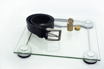 High angle view of camera on table against white background