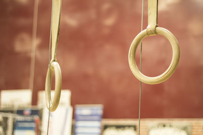 Close-up of metal hanging on rope