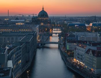 High angle view of illuminated buildings against sky during sunset