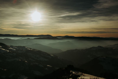 Scenic view of mountains against sky during sunset