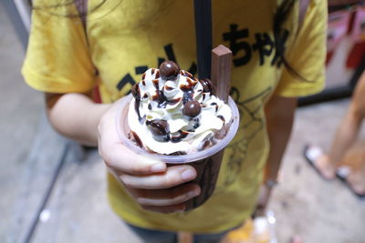Person holding ice cream cone