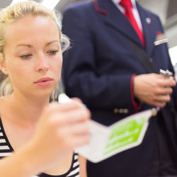 Close-up of woman sitting in train