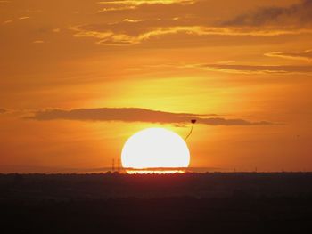 Silhouette landscape against sky during sunset