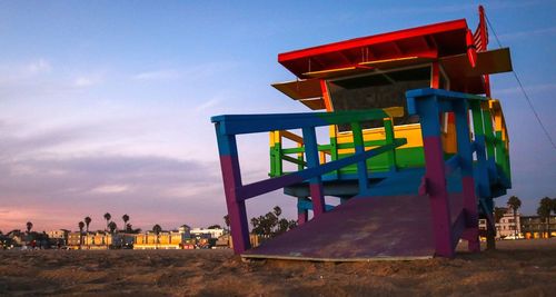 Built structure on beach against sky