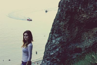 Young woman standing on beach