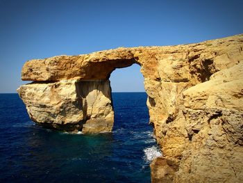 Scenic view of sea against blue sky