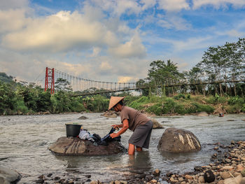 Man sitting on rock