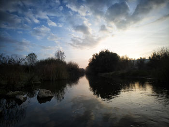 Scenic view of lake against sky during sunset