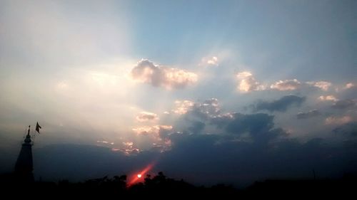 Low angle view of cloudy sky at sunset