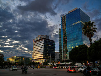 City street and buildings against sky