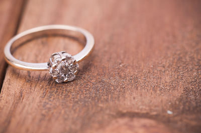 Close-up of wedding rings on table