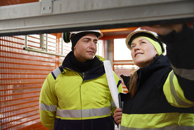 Engineers talking at building site