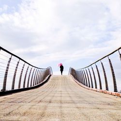 Full length of woman walking on road